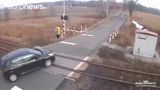 Train ploughs into car at level crossing in Poland