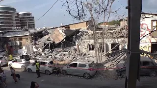 Buildings and vehicles in Tel Aviv sustained heavy damage in Hamas rocket barrage