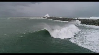 Surfing Nobbys Break wall Newcastle Harbour NSW Australia