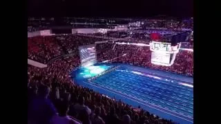 U.S. Swimming fans instantly unite to sing the National Anthem when the singer's microphone fails