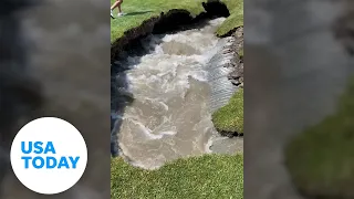 Giant sinkhole engulfs golf course fairway as golfers watch in awe | USA TODAY