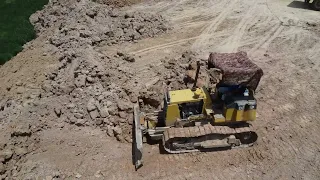 Dozer D31 and big Dump Truck pushing soil in to the Fields។