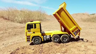 RC Mercedes low-loader truck, MAN dump truck, & Volvo EC160E excavator