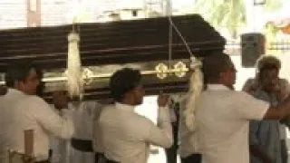 Negombo grieves, lays victims of church bombing to rest