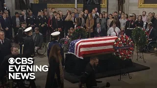 Bob Dole stands to deliver unforgettable salute to George H.W. Bush