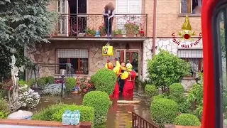 Italian firefighters rescue people stranded in flooding across Emilia-Romagna