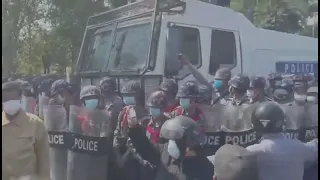 Remarkable scenes in Myanmar  Police openly join protesters as they are being shot with water cannon