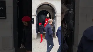 Beautiful lady from New York dresses for the occasion on Horse Guards.