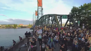 Protesters march to Waterfront park; crowd gathers outside reported home of Mayor Wheeler