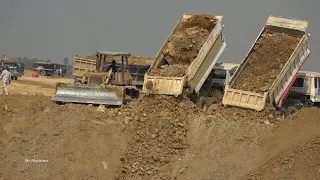 Power Machines Filling Land with Strong 10 Wheels Dump Truck and Bulldozer Extreme Spreading Dirt