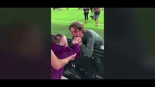 Brentford Coach Thomas Frank and Players celebrating with young fan after win against Arsenal