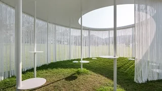 Oasis pavilion by OBBA provides shade with steel roof and thin curtains