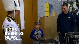 11-year-old boy surprised by Michigan marching band