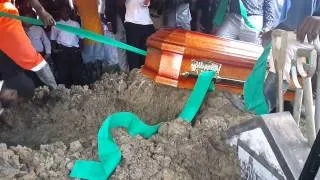 Son falls in grave during fathers burial