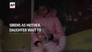 Sirens as mother, daughter wait to flee Sloviansk