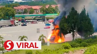 Plumes of smoke and loud bangs as fire rips through battery-laden lorry