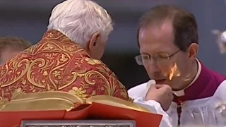 Mons. Marini receiving communion