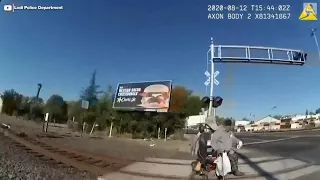 Officer saves man in wheelchair from oncoming train