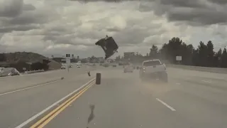 Tyre shoots off truck and flips car on Los Angeles freeway