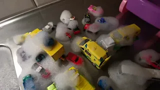 Lots of diecast model cars falling into water