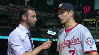 Trea Turner chats with Dan Kolko on field after Nats' win