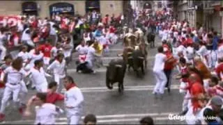 Pamplona bull run: lucky escape for runners as animals run wild in festival