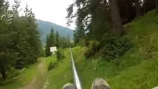 Exited Man in Alpine Coaster Stun a Girl by Crashing Into Her