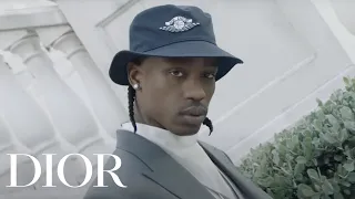 Travis Scott models the Air Dior line