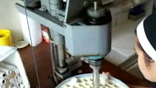 Cutting altar breads.wmv