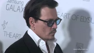 Johnny Depp and his fiancee Amber Heard arrive at The Art of Elysium Heaven Gala, LAA