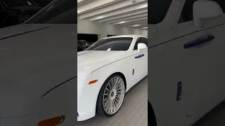 Do you like this Rolls Royce Wraith in matte white with blue accents?