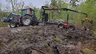 Gräver och jämnar ut jord med skogsvagnen³