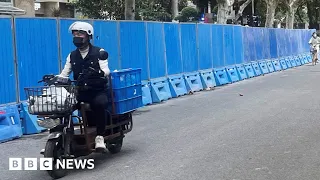 China police install barriers in Shanghai in effort to curb Covid protests - BBC News