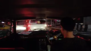 Driving an Alfa Romeo 1750 GTV at night in Bangkok during Covid