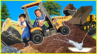 Excavator digging dirt at construction site with kids ride on backhoe digger and excavator bulldozer