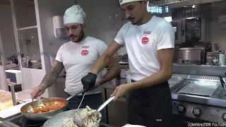 Cooking Lots of Italian Pasta. Food of Turin, Torino, Italy