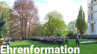 German honor formation brings troop flag with military marching music "Regimental salute"