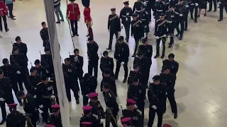 AMAZING SCENES!  Waterloo station  as 6,000 armed forces staff arrive for the Coronation rehearsal