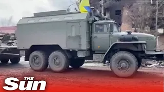 Ukrainian military vehicles re-enter desolate and destroyed town of Sumy