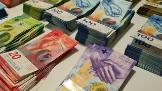 100,000 CHF in cash. Swiss money counting.