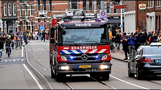 Brandweer, Ambulance en Politie met spoed tijdens Koningsdag in Amsterdam