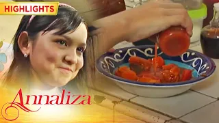 Arlene pours hot sauce all over the dish Annaliza has prepared | Annaliza