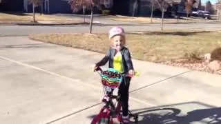 Tessa rides her new bike