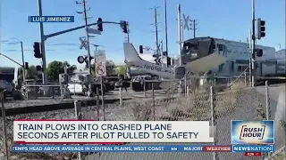 California Police pull pilot to safety seconds before train hits plane | Rush Hour