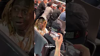 Lil Wayne looks shocked sitting ringside for Spence vs Crawford fight