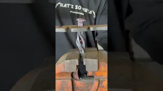 Forging a marble inside a railroad spike