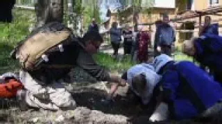 Aftermath of deadly shelling, rebels at frontline