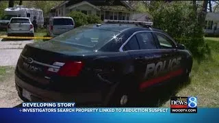 Police search Norton Shores property linked to abduction suspect