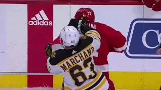 Scrum ensues after Brad Marchand started throwing punches on Dylan Larkin following the cross-check