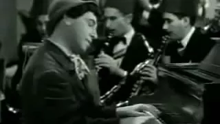 Chico Marx playing piano in "A Night At Casablanca"